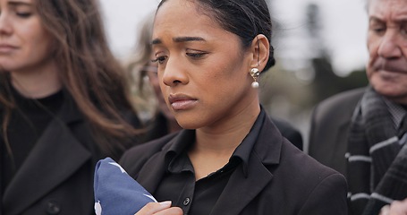 Image showing People, sad and woman with grief, funeral and loss with death, compassion and depression. Person, family or wife with a flag, loved one or pain with stress, goodbye or respect with mourning or burial