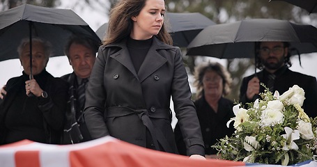 Image showing USA veteran funeral, woman and sad to touch casket, family and flag with mourning, depression and respect. Widow, people and army service with coffin, burial and crying for war hero in Philadelphia