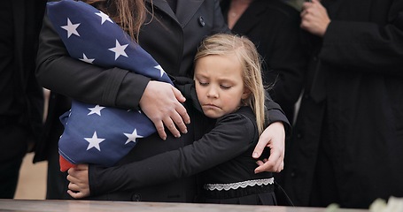 Image showing Sad, hug and a child at a funeral or graveyard for a ceremony or death with family. Depression, young and a girl kid with a person for comfort at a cemetery for mourning, grief together or loss