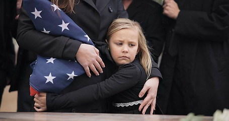 Image showing USA veteran funeral, girl and sad family with hug, care and flag for mourning, depression and comfort with mom. Kid, people and service with coffin, burial or memorial with war hero in Philadelphia