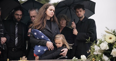 Image showing Funeral, family and sad people with American flag, grief and mourning death, burial and widow depressed at farewell event. Kid, mother and group gathering at coffin, casket and crying at ceremony