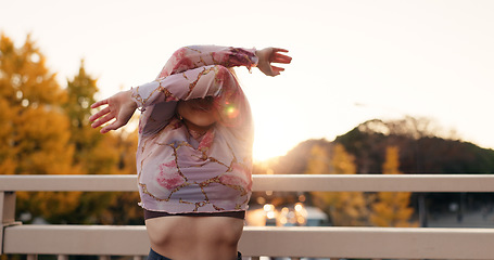 Image showing Outdoor, dancing and woman with energy, culture and performance with training, routine and creative industry. Talent, contemporary dancer and girl with sunshine, movement and Japan with practice