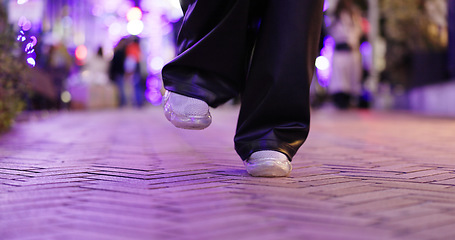 Image showing Closeup, feet and person dancing in street, moving body or freedom for performance, city or night. Girl, dancer or sneakers for art, concert and steps with creativity, metro road and balance in Tokyo