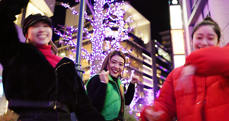 Image showing Japanese women at night, dancing in city and fun with energy, happiness and celebration outdoor. Freedom, dancer group and smile on urban street in Tokyo, friends together and gen z with nightlife