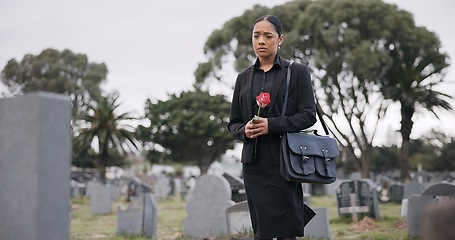 Image showing Sad woman, graveyard and rose on tombstone in mourning, loss or grief at funeral or cemetery. Female person with flower in depression, death or goodbye at memorial or burial service for loved one