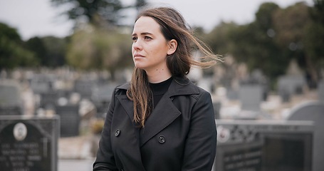 Image showing Rose, death or sad woman in cemetery for funeral. spiritual service or burial to respect the Christian religion. Mourning, depressed or person in graveyard thinking of grief, loss or goodbye farewell