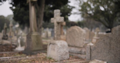 Image showing Funeral, empty graveyard and tombstones for death ceremony, religion or memorial service. Catholic symbol, background or Christian sign on gravestone for mourning, burial or loss in public cemetery