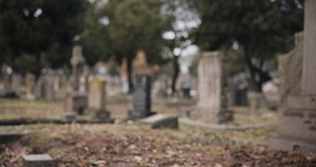 Image showing Graveyard, burial and tombstone in cemetery for death ceremony, funeral ritual and memorial service. Headstone, rip and resting place of departed for mourning, loss and remembrance of dead by church