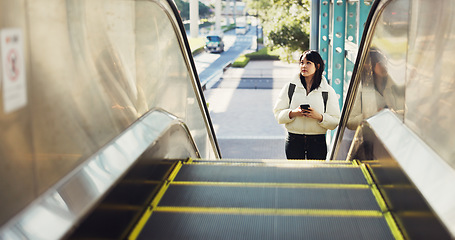 Image showing Woman, stairs and smartphone for commute, texting and japanese on social media app. Technology, communication and text message for digital, internet and chatting with backpack, travel and escaltor