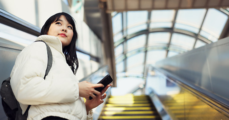 Image showing Woman, stairs and smartphone for commute, texting and japanese on social media app. Technology, communication and text message for digital, internet and chatting with backpack, travel and escaltor