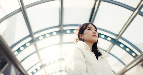 Image showing Thinking, city and Japanese woman on bridge on commute, travel and journey in metro. Student, fashion and person with trendy clothes, backpack or bag for university, college and adventure in town