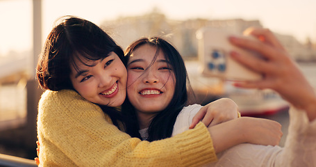 Image showing Friends, women and hug with selfie, Japanese influencer team outdoor with memory and social media post. Happiness, friendship date in Kyoto with travel and smile in picture, photography and adventure