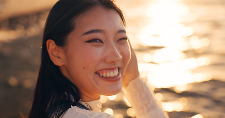 Image showing Japanese, woman and face, ocean and sunset with travel, tourism and happiness in nature. Environment, sea and traveller on adventure or journey, sunshine and portrait and tropical trip in Kyoto
