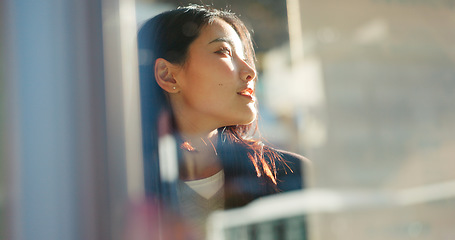 Image showing Japanese woman, thinking and city on street, travel and outdoor on vacation, direction or journey. Girl, person and holiday with vision, memory or ideas on metro sidewalk, road and sunshine in Tokyo