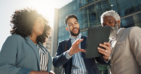 Image showing Business people, outdoor and walking with conversation, tablet and New York city with professionals. Corporate, urban town and group with ideas, technology and summer with social media and connection