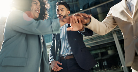 Image showing Business people, hands stack celebration and excited in city for goals, support and profit on investment. Men, woman and cheers together for winning, success and achievement with team in Cape Town