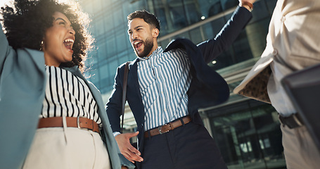 Image showing Business people, hands stack celebration and excited in city for goals, support and profit on investment. Men, woman and cheers together for winning, success and achievement with team in Cape Town