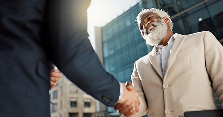 Image showing Outdoor, business people and men with handshake, greeting and contract with lens flare, corporate and smile. Staff, employees in a city and coworkers with hello, partnership and about us with friends