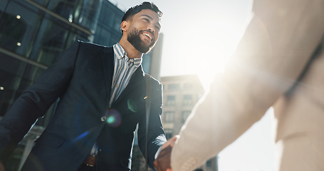 Image showing Outdoor, business people and men with handshake, greeting and contract with corporate, New York and smile. Staff, employees in a city and coworkers with hello, partnership and buildings with friends