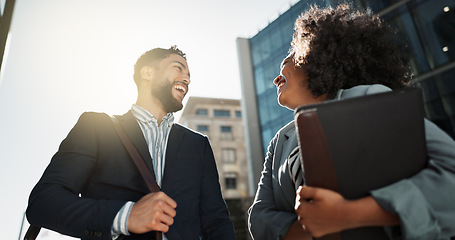 Image showing Outdoor, business people and conversation with handshake, greeting and contract with lens flare, corporate and smile. Travel, employees in a city and coworkers with hello, partnership and friends