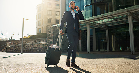 Image showing Business man, suitcase and phone call in city for professional communication, transport and travel news or information. Happy corporate worker with mobile chat, luggage and walking outdoor to airport