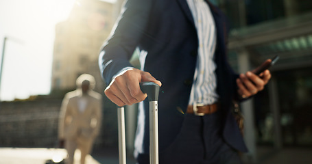 Image showing Business man, phone and suitcase in street, hands and search for location, travel and transport to airport Corporate employee, smartphone and walk with baggage, luggage or urban sidewalk in Cape Town