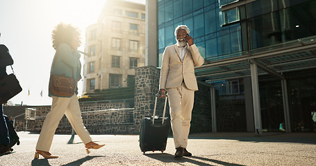 Image showing Business man, phone call and suitcase in city, street or conversation for booking, travel or transportation. Senior corporate executive, smartphone or luggage on talk, chat or sidewalk in Cape Town