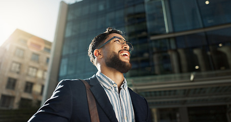 Image showing Business, travel and happy man thinking in a city for vision for future, dream or opportunity. Urban, building and male entrepreneur in London with mindset, planning or idea, commute or inspiration