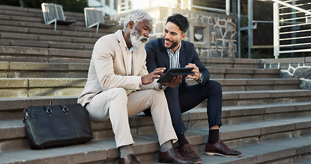 Image showing Tablet, conversation and business men in the city in discussion for corporate legal case. Teamwork, collaboration and male attorneys with digital technology sitting and talking on stairs in town.