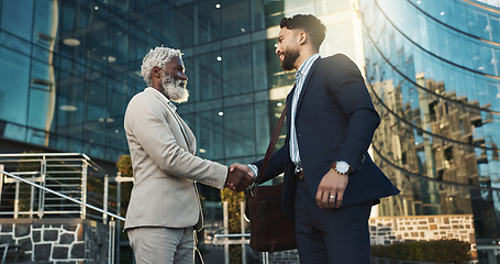 Image showing Business men, handshake and meeting in city for b2b partnership, outdoor deal and travel introduction or welcome. Corporate clients and senior boss shaking hands with time or schedule for consulting