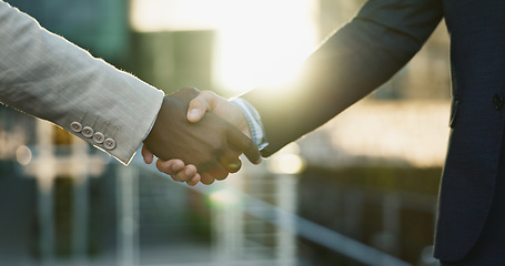 Image showing Business people, shaking hands and city meeting for b2b partnership, outdoor deal and travel success. Corporate or professional clients handshake for consulting, welcome or introduction in urban town