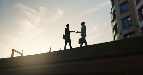 Image showing Business people, handshake and city silhouette for partnership, outdoor introduction and travel meeting. Corporate clients or men shaking hands for welcome, hello and agreement or career opportunity