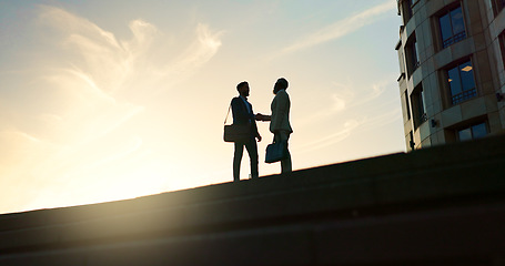 Image showing Business people, handshake and city silhouette for partnership, outdoor introduction and travel meeting. Corporate clients or men shaking hands for welcome, hello and agreement or career opportunity