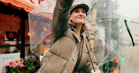 Image showing Woman, street and stop taxi with umbrella in rain, smile or winter for travel, transport or driver in city. Girl, person or tourist in metro for bus, driver or chauffeur on road with parasol in Tokyo