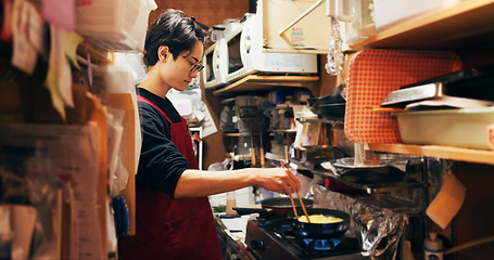 Image showing Japanese chef man, cooking and kitchen by stove, service or catering job on pan, pot and ready. Person, restaurant or cafeteria with chopsticks for meal prep, working or thinking for recipe in Tokyo