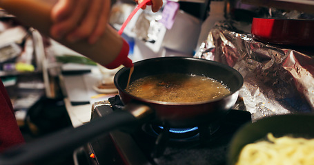 Image showing Cooking, sauce and person with pan on gas stove at food market for meal preparation, eating and nutrition. Culinary, restaurant and closeup of utensils to prepare lunch, cuisine dinner and supper