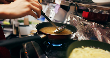 Image showing Cooking, sauce and person with pan on gas stove at food market for meal preparation, eating and nutrition. Restaurant, flame and closeup of utensils to prepare lunch, cuisine dinner and supper