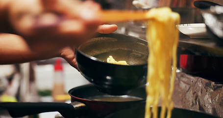 Image showing Cooking, food market and person with noodles on gas stove for meal preparation, eating and restaurant. Japanese culinary, flame and closeup of chopsticks to prepare lunch, cuisine dinner and supper