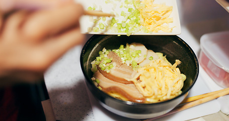 Image showing Japanese, ramen and food in restaurant with spring onion and ingredients, chopsticks and chef skill with decoration. Person cooking traditional cuisine, closeup with nutrition and garnish on noodles