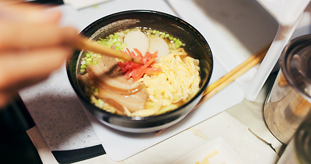 Image showing Ramen food, plate and table in restaurant with person, hands and ginger with closeup for Japanese cuisine. Niboshi bowl, chopsticks and pork for diet, nutrition and catering for wellness in Tokyo