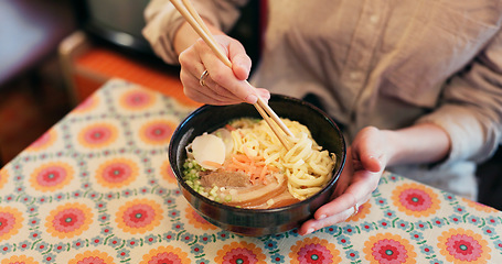 Image showing Ramen food, plate and table in restaurant with person, hands and ginger with closeup for Japanese cuisine. Niboshi bowl, chopsticks and pork for diet, nutrition and catering for wellness in Tokyo