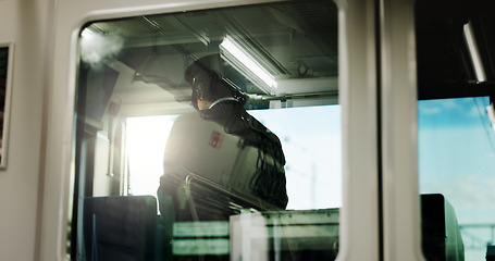 Image showing Train, conductor and window or transportation for travel Japan, control room or adventure. Male person, uniform and railroad tourism in Tokyo for public journey as commuter for job, safety or transit