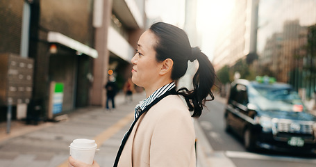 Image showing Coffee, walking and Japanese business woman in the city crossing the road to work or job. Cappuccino, travel and professional young female person commuting with caffeine in the morning in urban town.