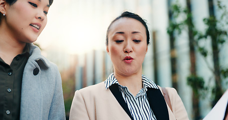 Image showing Walking, city and women speaking about report for business, collaboration or coaching in Japan. Corporate, help and Japanese employees talking about paperwork or a document for professional teamwork