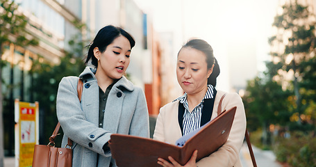 Image showing Businesswomen, japan and discussion by sidewalk in city, walking and collaboration on working in corporate career. Manager, employee or communication in professional job in kyoto or project feedback