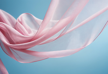 Image showing Flying pink fabric wave on blue sky background and illuminated b