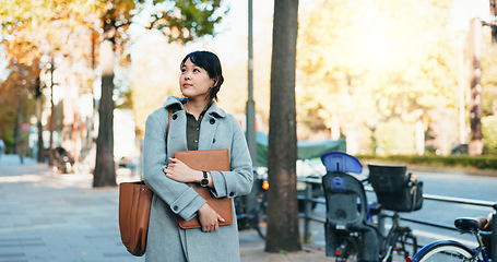 Image showing Thinking, city and Japanese business woman with ideas for morning commute, journey and travel to work. Professional, corporate and person in urban town wondering for career, working and job ambition