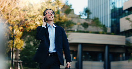 Image showing Phone call, walking and business man on city journey, morning travel and speaking on mobile discussion. Smartphone conversation, communication and Japanese agent talking with contact on urban commute