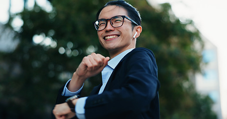 Image showing Happy, dancing and Japanese businessman in the city with good news, job promotion or achievement. Smile, excited and professional young male person moving to music, playlist or radio in urban town.