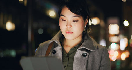 Image showing Business woman, city and tablet at night to scroll website, reading information and update app online. Japanese worker with digital software, social network or search internet in dark street of Tokyo